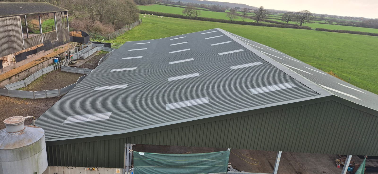 Roof after asbestos removal — clean new corrugated metal roofing